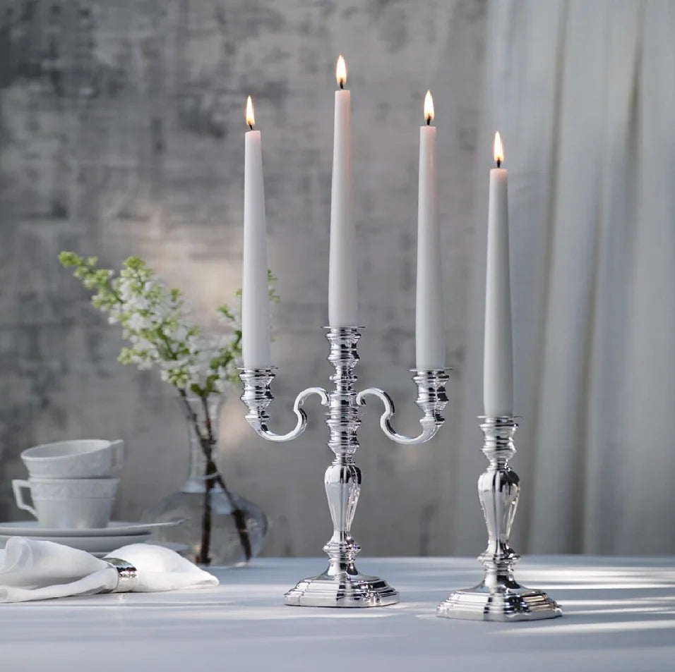 Modern silver three arm candelabra showcasing a swooping branches, available at wholesale prices.